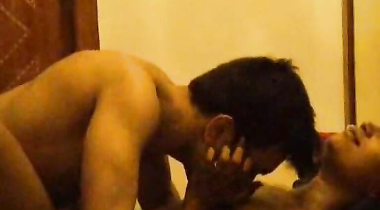 Indian Playboy Akhil in bed with her airhostess GF kissing her and stripping off clothes leaving her only black bra and panty and enjoying her body.