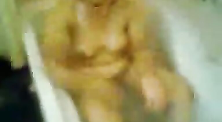 Sanam bhabhi from Lahore in bath tube taking shower while her hubby is filming her action!.