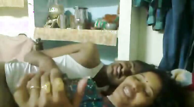 Mumbai raand after sex with her pimp laying watching a porn movie on his mobile who is playing with her boobs.