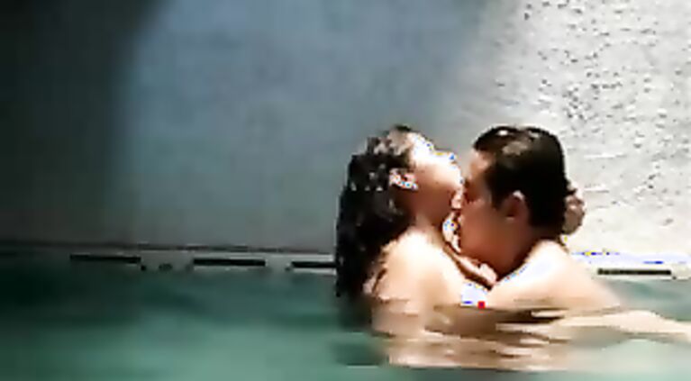 Newly married Indian couple on their honeymoon in Mauritius hotel swimming pool getting naughty.