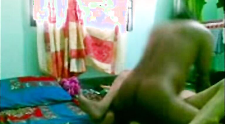 She moans loudly and her body writhes in intense pleasure.