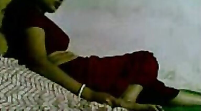 Bangladeshi housewife lying on her stomach and her hubby caressing her big round ass cheeks and playing her boobs and nipples during foreplay and fucked in missionary position.
