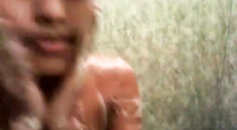 Curvy Indian babe with big tits taking a shower.