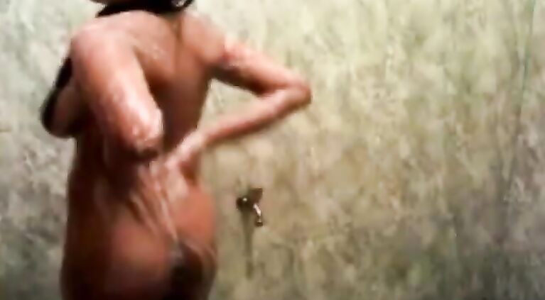 Curvy Indian babe with big tits taking a shower.