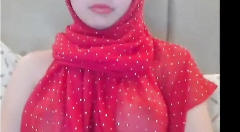 Cute Arab camgirl shows boobs.