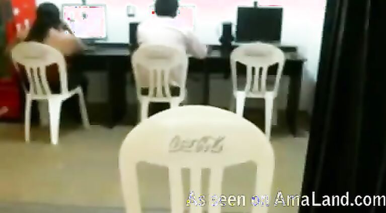 Hot Indian babe strips and flashes her tits inside a cyber cafe.