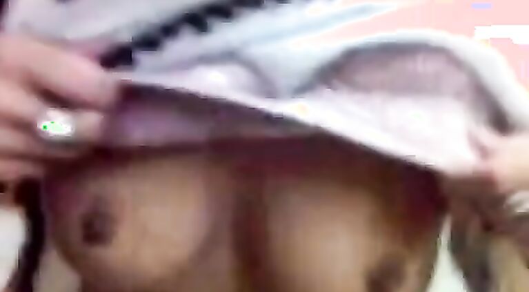 Teen shows tits.