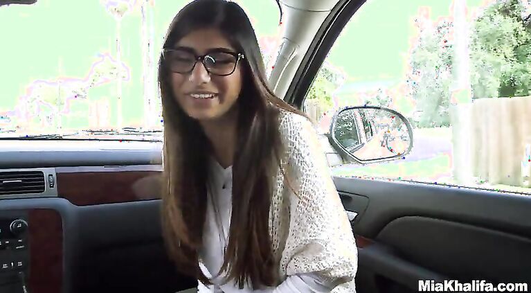 We're driving Mia Khalifa around the city projects looking for a big black cock to fuck.