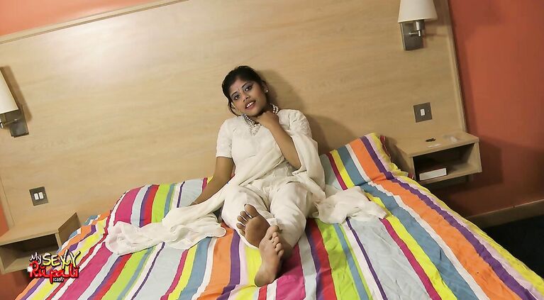 White pearl babe Rupali does a little strip tease show for you.