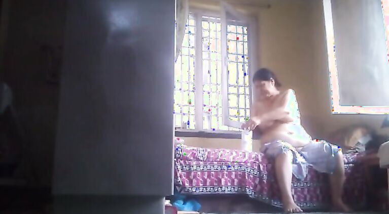 Tamil grannie rubs lotion after bath