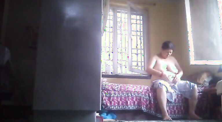 Tamil grannie rubs lotion after bath