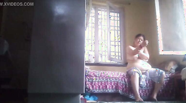 Tamil grannie rubs lotion after bath