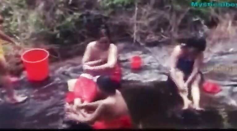 mallu aunties taking bath in public watched by a man hiding