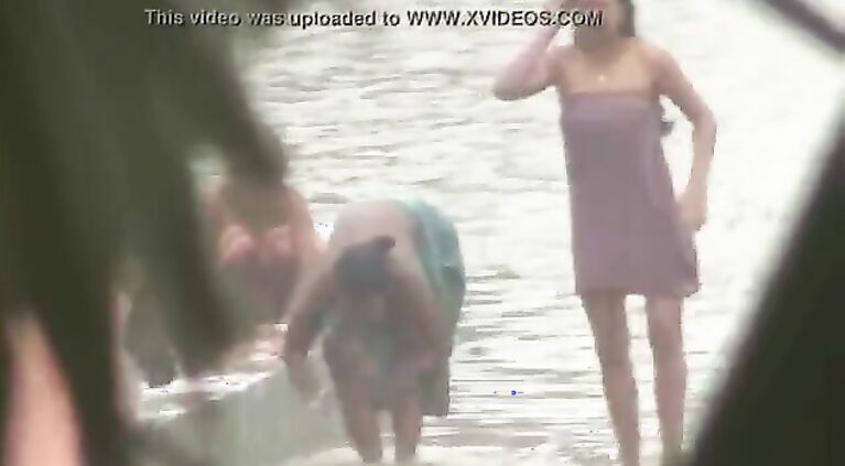 Tamil women bathing by the river