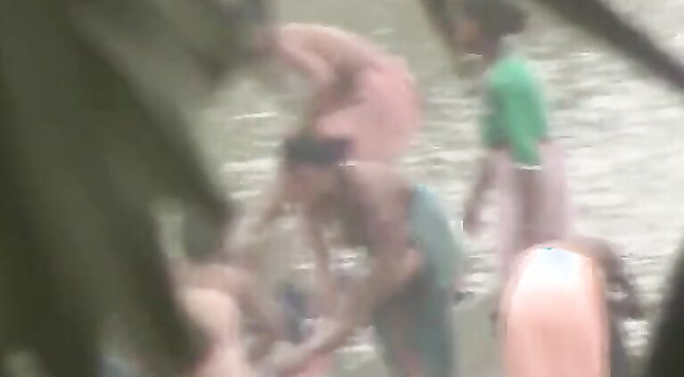 Tamil women bathing by the river