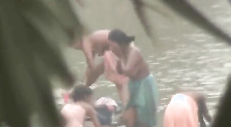 Tamil women bathing by the river