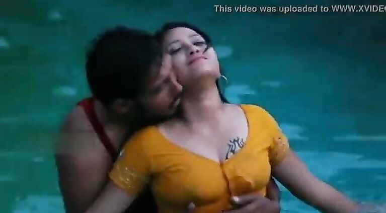 Lovers beautiful romance in swimming pool