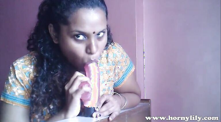 South tamil sucks on toy